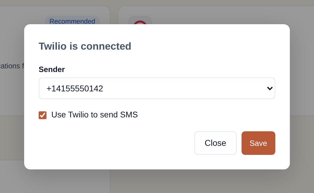 The 'Twilio is connected' step of the connect window: a Sender dropdown showing a phone number, a ticked 'Use Twilio to send SMS' checkbox, and Close and Save buttons